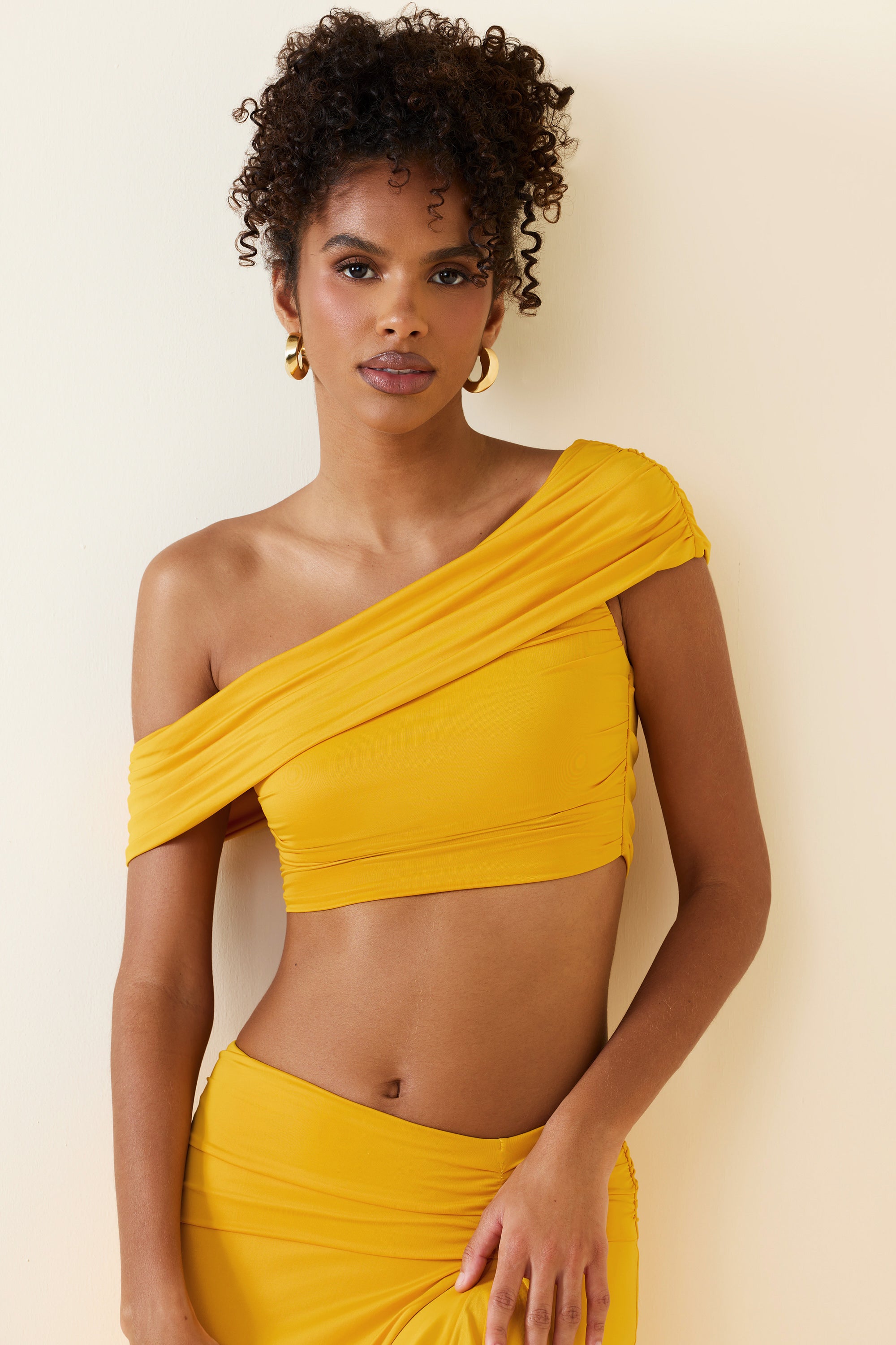 Inga Asymmetric Ruched Off-Shoulder Crop Top in Golden Yellow